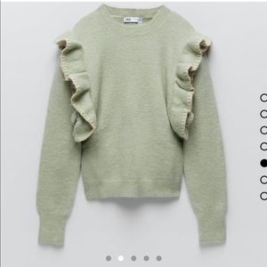 Wool knit sweater with ruffled shoulders